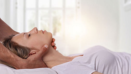 Woman receiving neck adjustment from Sandpoint chiropractor