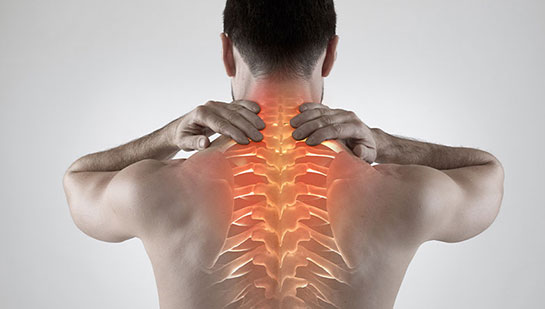 Man with upper back pain before chiropractic treatment from Sandpoint chiropractor